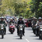 Gunakan Motor, Pj Wali Kota Kotamobagu Pantau Sejumlah TPS